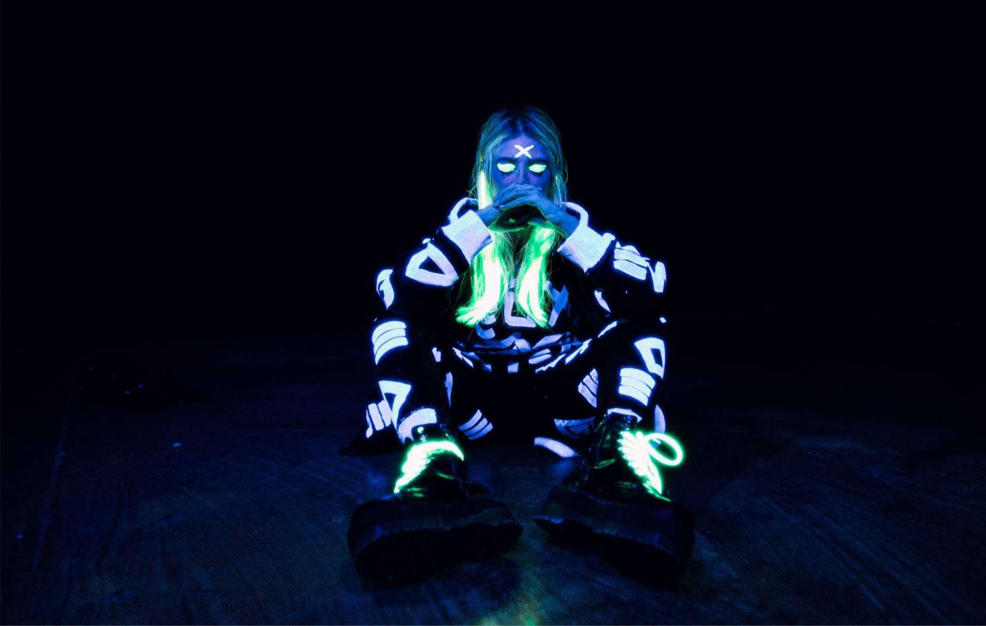 Whyte Fang, AKA Alison Wonderland, posing in glow in the dark