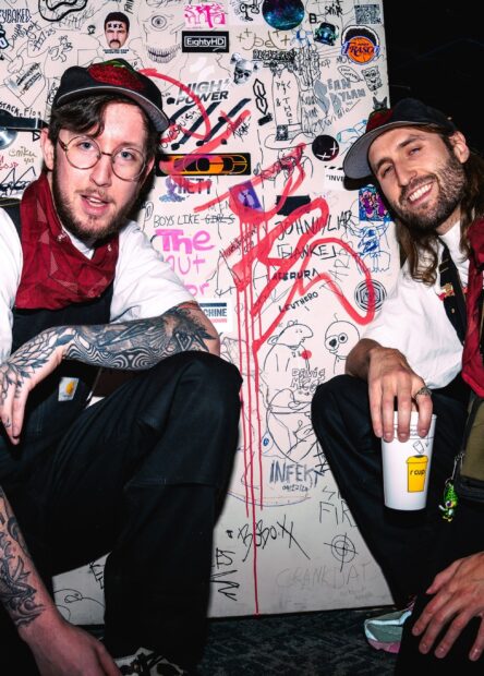 BLAAP duo Freddy Todd and Of The Trees pose by a graffiti wall, promoting the ‘VOLCANOLOGY’ album featuring the explosive single ‘GLADIUS.